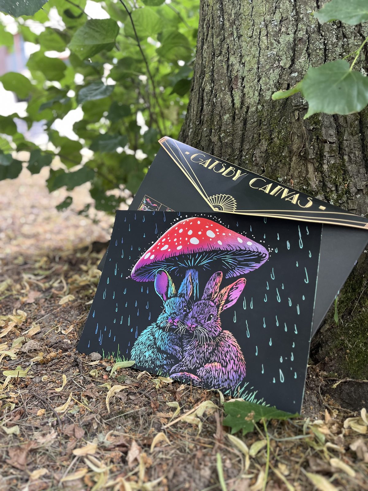 A finished Calming Nature rabbits scratch-art canvas displayed on a shelf